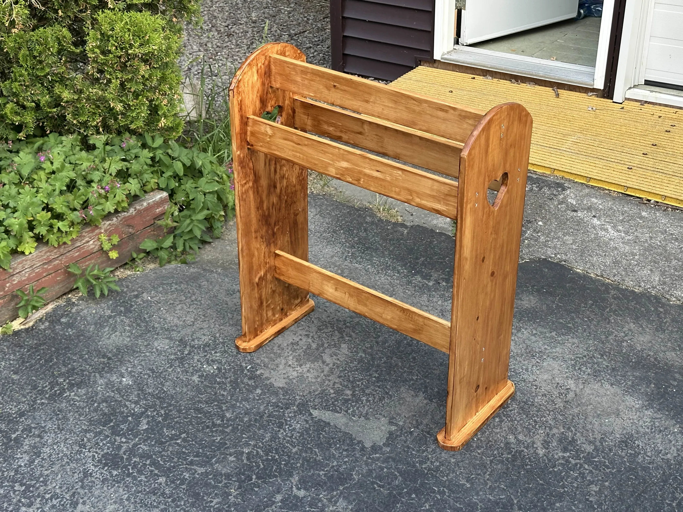 Pine blanket holder with stain blotches